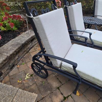 LOT 285: Four Single and One Double Metal Lounge Chairs with Cushions and Two Round Tables