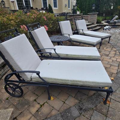 LOT 285: Four Single and One Double Metal Lounge Chairs with Cushions and Two Round Tables