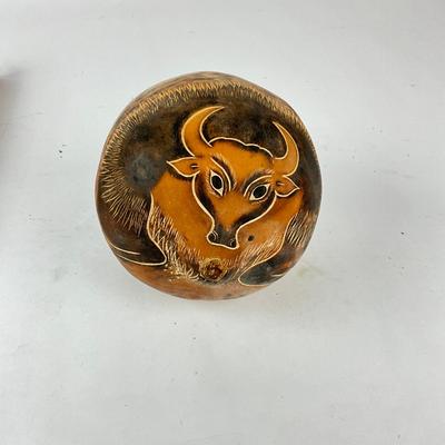 Sale Photo Thumbnail #1486: Abstract textured tube, hand-engraved bull motif
Tube: 11.5" long x 3" wide
Bull: 4.5" high x 4.5" wide