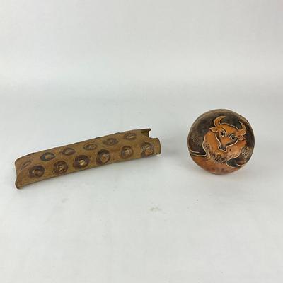 Sale Photo Thumbnail #1483: Abstract textured tube, hand-engraved bull motif
Tube: 11.5" long x 3" wide
Bull: 4.5" high x 4.5" wide