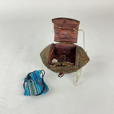Sale Photo Thumbnail #1504: Has small drawstring pouch, front lock and hinge, lined with fabric