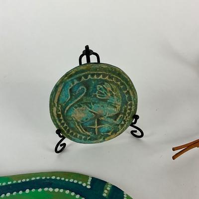 Sale Photo Thumbnail #1506: Painted wooden snake, small clay medallion signed on back 1997 and hand-made doll
Snake: 25" long
Doll: 10" high
Medallion: 3.5" diameter