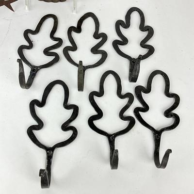 Sale Photo Thumbnail #1512: Bird silhouette hooks, leaf wall hooks, primitive tin plate
Leaf hooks: 6.75" high x 3.25" wide
Bird: 5.5" deep x 4" high
Plate: 7.5" diameter