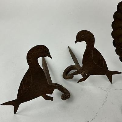 Sale Photo Thumbnail #1510: Bird silhouette hooks, leaf wall hooks, primitive tin plate
Leaf hooks: 6.75" high x 3.25" wide
Bird: 5.5" deep x 4" high
Plate: 7.5" diameter