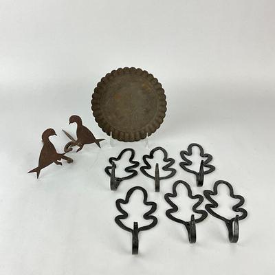 Sale Photo Thumbnail #1509: Bird silhouette hooks, leaf wall hooks, primitive tin plate
Leaf hooks: 6.75" high x 3.25" wide
Bird: 5.5" deep x 4" high
Plate: 7.5" diameter