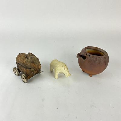 Sale Photo Thumbnail #1523: Hand-carved bunny pull toy, Stone Bear Figure & signed Studio Pottery Pig Bowl By Robert Maxwell
Bowl: 4.5" diameter x 4.5" high
Bear: 4" long x 2.25" high
Bunny: 5.5" long x 4.25" high