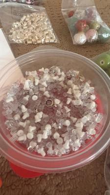 BEADS, AN ENGRAVER AND JEWELRY MAKING TOOLS