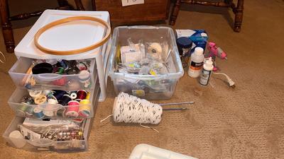 A DRAWER ORGANIZER LOADED WITH SEWING NOTIONS AND OTHER ITEMS