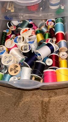 A DRAWER ORGANIZER LOADED WITH SEWING NOTIONS AND OTHER ITEMS