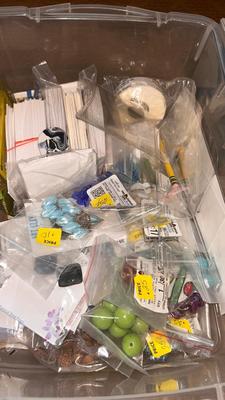 A DRAWER ORGANIZER LOADED WITH SEWING NOTIONS AND OTHER ITEMS