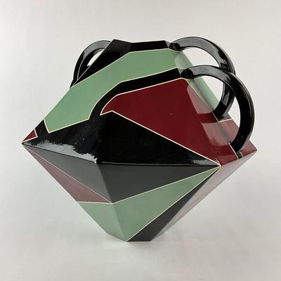 Sale Photo Thumbnail #1572: Glazed Ceramic
Mouth Of vase is 5.5" diameter
Measures: 14.5" high x 18" wide x 18" deep