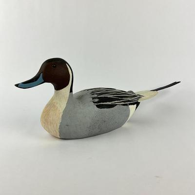 Sale Photo Thumbnail #1593: Tail feather was once broken, has been re-glued
Carving company: Colonel's Carvings
Measures: 7" high x 20" long x 5.25" wide