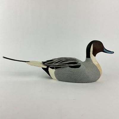 Sale Photo Thumbnail #1597: Tail feather was once broken, has been re-glued
Carving company: Colonel's Carvings
Measures: 7" high x 20" long x 5.25" wide