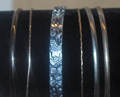 Collection of 6 Silver Colored BANGLE BRACELETS (2½" Opening) with Stars and Graphics