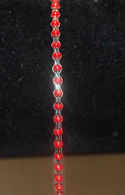 Single Row of Bright RED BEADS BANGLE BRACELET (2¾" Opening) on a Silver Tone Circle Ring