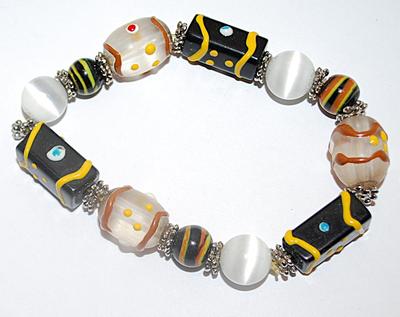 Unique Yellow & Black Bead Elastic BRACELET (2½" to 4" Opening) with Iridescent Globes, Spotted Ovals and Silver Tone...