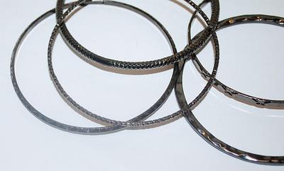 Collection of 5 Black BANGLE BRACELETS (2½" Opening) with Assorted Finishes