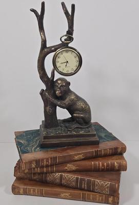 LOT 34Z: Monkey Clock and Four Antique Books
