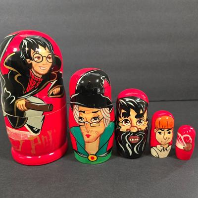 LOT 90X: Harry Potter Books, Nesting Dolls, and Sign