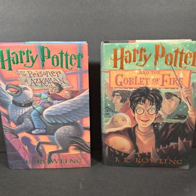 LOT 90X: Harry Potter Books, Nesting Dolls, and Sign