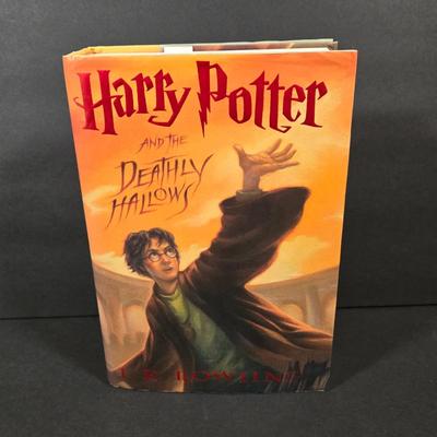 LOT 90X: Harry Potter Books, Nesting Dolls, and Sign