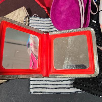 LOT 97X: Multiple Hand Bags, Coin Purses, and More