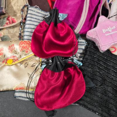 LOT 97X: Multiple Hand Bags, Coin Purses, and More