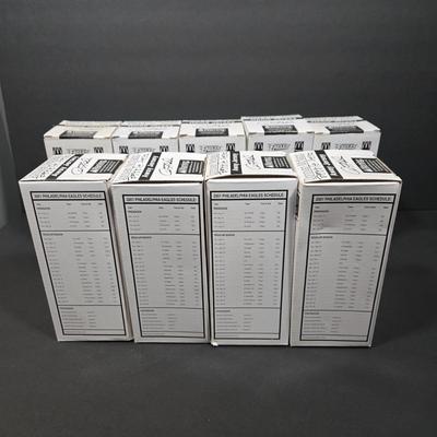 LOT 106Z: NIB Donovan McNabb Bobble Heads/ 5 Home Jerseys, 4 Away