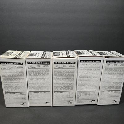 LOT 106Z: NIB Donovan McNabb Bobble Heads/ 5 Home Jerseys, 4 Away