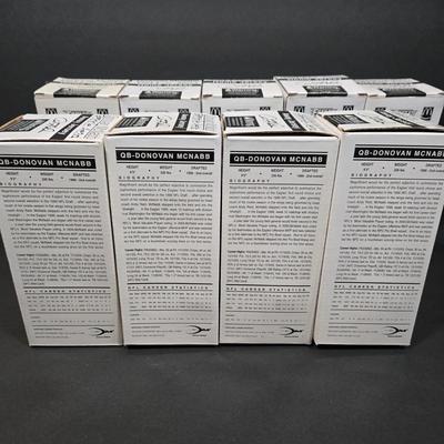 LOT 106Z: NIB Donovan McNabb Bobble Heads/ 5 Home Jerseys, 4 Away