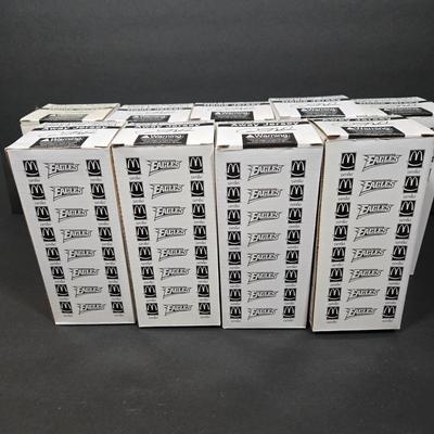 LOT 106Z: NIB Donovan McNabb Bobble Heads/ 5 Home Jerseys, 4 Away