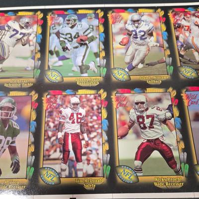 LOT 106Z: Five Fleer 1999 Diamond Skills Commemorative Sheets and Four Premier NFL Edition Uncut Sheets