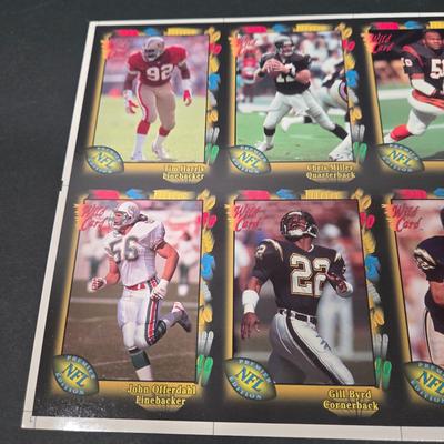 LOT 106Z: Five Fleer 1999 Diamond Skills Commemorative Sheets and Four Premier NFL Edition Uncut Sheets