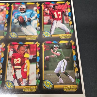 LOT 106Z: Five Fleer 1999 Diamond Skills Commemorative Sheets and Four Premier NFL Edition Uncut Sheets