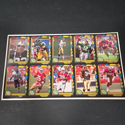 LOT 106Z: Five Fleer 1999 Diamond Skills Commemorative Sheets and Four Premier NFL Edition Uncut Sheets