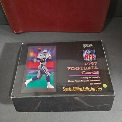 LOT 119Z: Numbered The Football Thesaurus by Deke Houlgate, Football Trading Card Binder with Plastic Protective Sheets, and Playoff NFL...