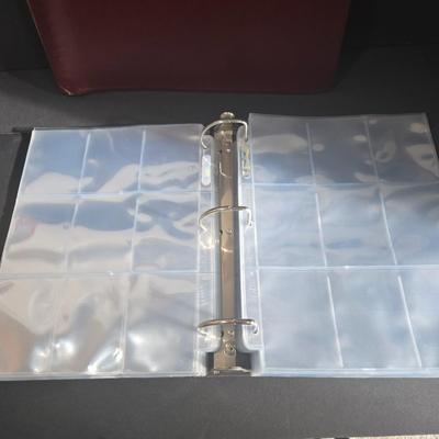 LOT 119Z: Numbered The Football Thesaurus by Deke Houlgate, Football Trading Card Binder with Plastic Protective Sheets, and Playoff NFL...