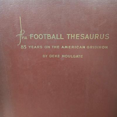 LOT 119Z: Numbered The Football Thesaurus by Deke Houlgate, Football Trading Card Binder with Plastic Protective Sheets, and Playoff NFL...