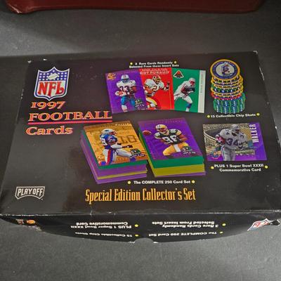 LOT 119Z: Numbered The Football Thesaurus by Deke Houlgate, Football Trading Card Binder with Plastic Protective Sheets, and Playoff NFL...