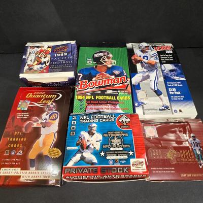 LOT 151Z: Multiple Boxes of Football Trading Cards