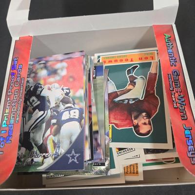LOT 153Z: Variety of Boxes of Football Trading Cards and Numerous Plastic Holders