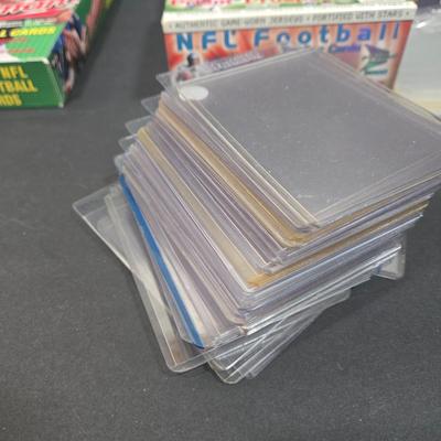 LOT 153Z: Variety of Boxes of Football Trading Cards and Numerous Plastic Holders