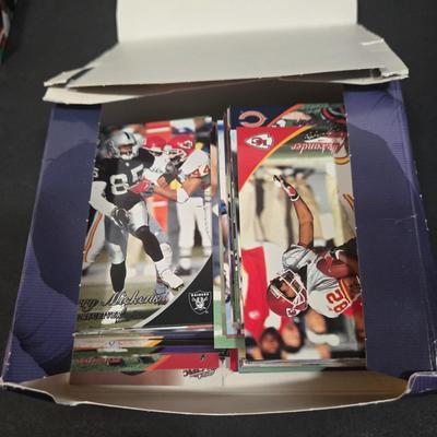 LOT 153Z: Variety of Boxes of Football Trading Cards and Numerous Plastic Holders