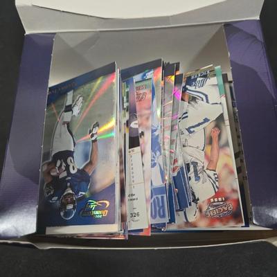 LOT 153Z: Variety of Boxes of Football Trading Cards and Numerous Plastic Holders