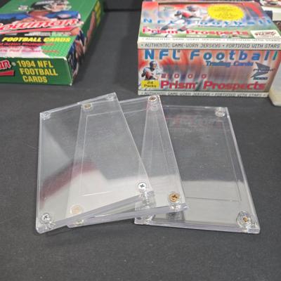 LOT 153Z: Variety of Boxes of Football Trading Cards and Numerous Plastic Holders