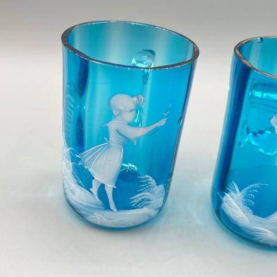 LOT 36: Six Antique Hand-Painted Mary Gregory Blue Glass Mugs