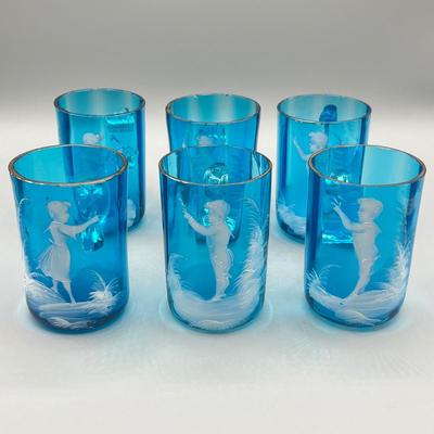LOT 36: Six Antique Hand-Painted Mary Gregory Blue Glass Mugs