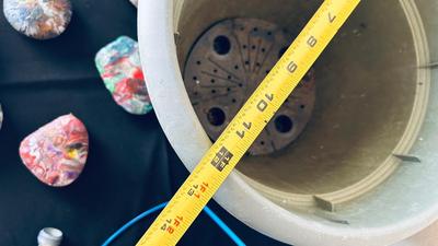 PLANTERS, PAINTED ROCKS, TOMATO CAGE AND SPRINKLER