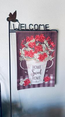 OUTSIDE SEASONAL WELCOME FLAGS, PICNIC BASKET, PESTICIDES, WALL PLANTER, AND WIND CHIME