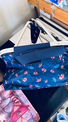 OUTSIDE SEASONAL WELCOME FLAGS, PICNIC BASKET, PESTICIDES, WALL PLANTER, AND WIND CHIME